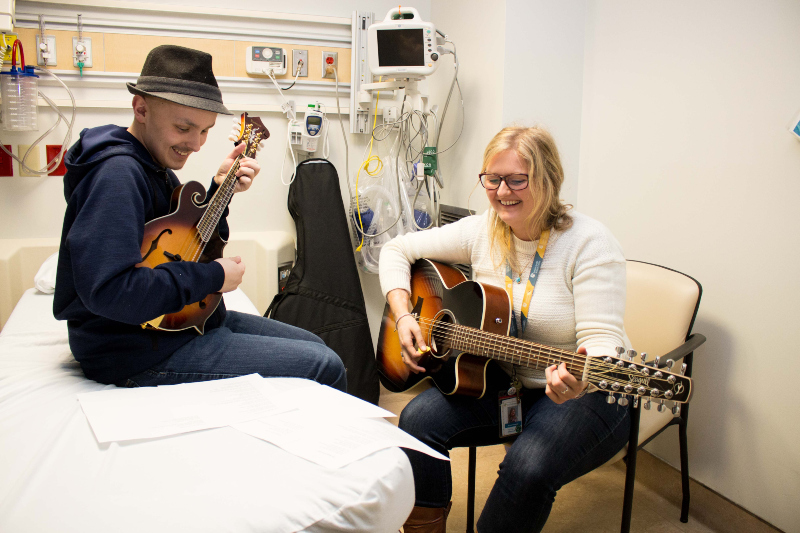 Child participating in Music Therapy